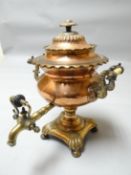 A good highly decorative heavy quality copper and brass samovar with domed lid and on shaped base