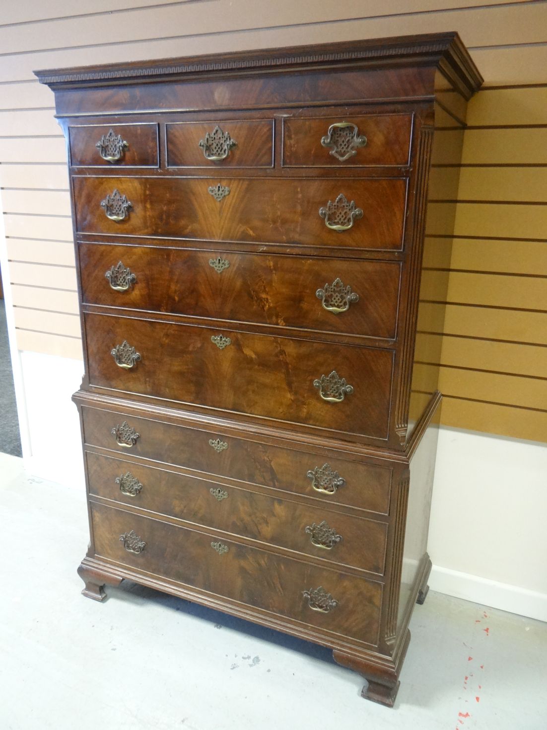 A Waring & Gillow mahogany chest-on-chest, the base having three long graduated drawers, below a top