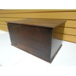 A primitive oak coffer-bach with single base drawer, 23 ins wide (59 cms)