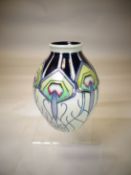 A Moorcroft pottery narrow neck vase in the 'Honeymoon' pattern, 6 ins high (15 cms)