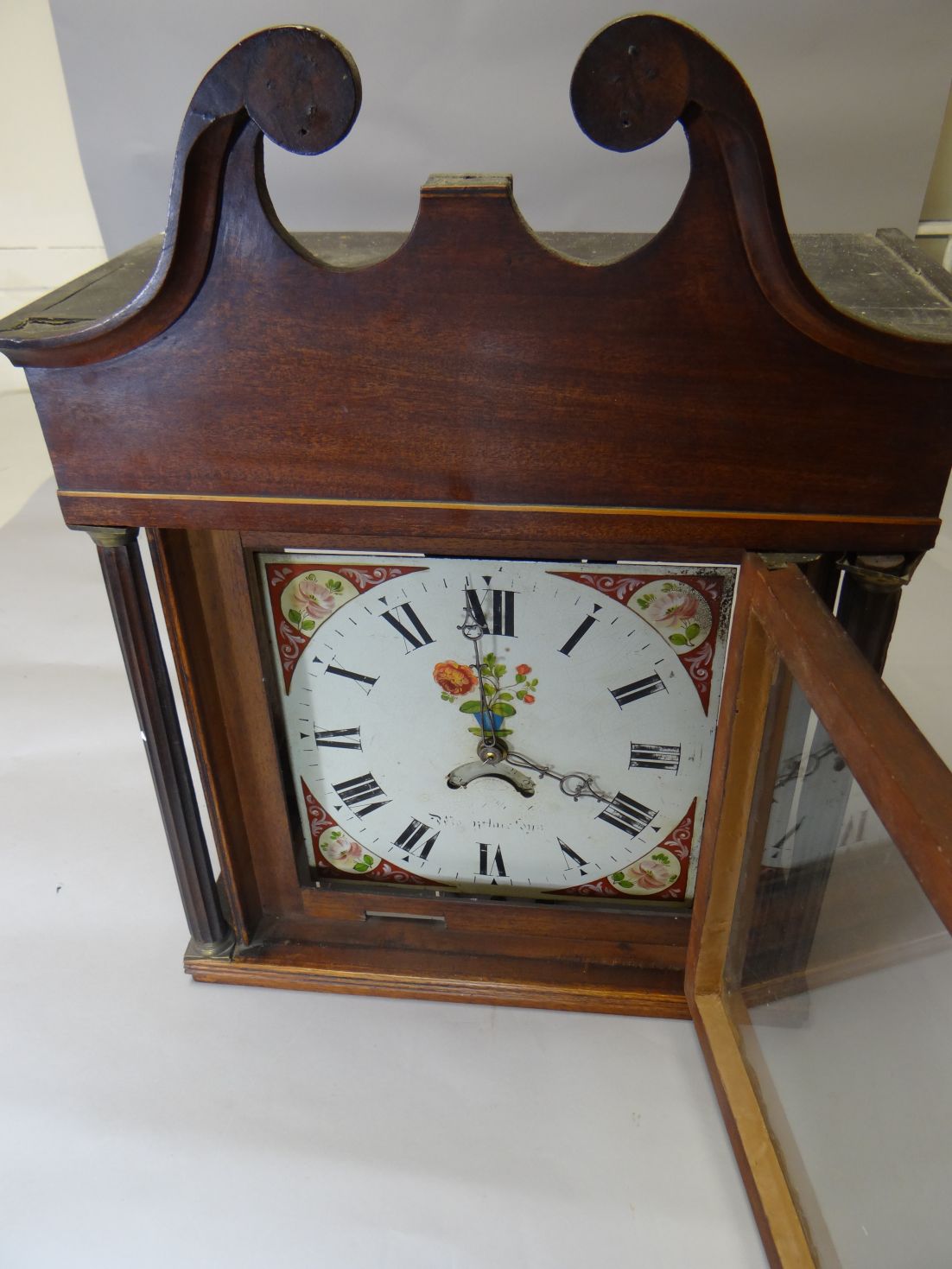 An early nineteenth century string inlaid mahogany thirty-hour longcase clock, having a painted dial