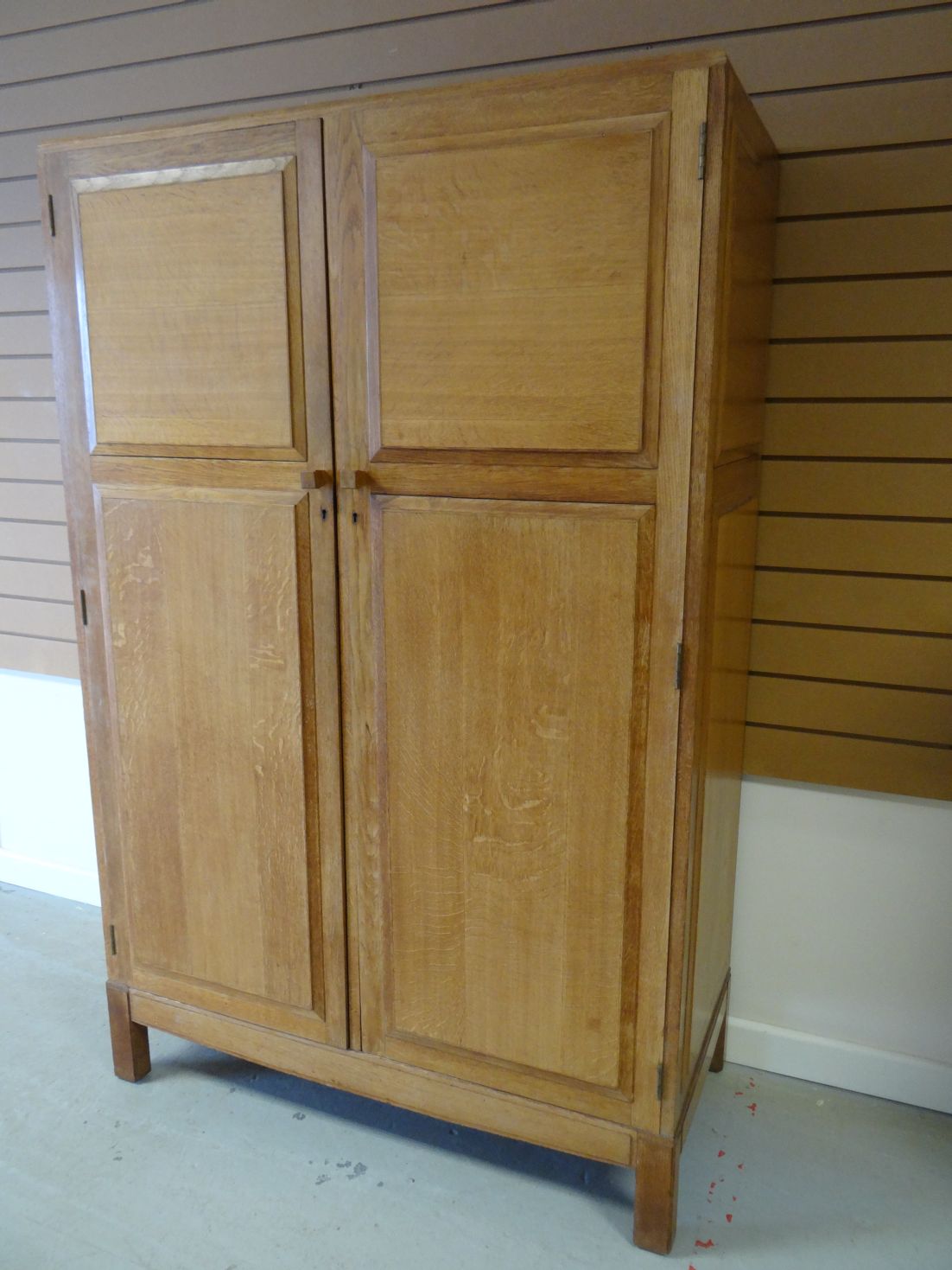 A light oak Brynmawr Furniture 'Merthyr' double wardrobe, having panelled doors and with interior