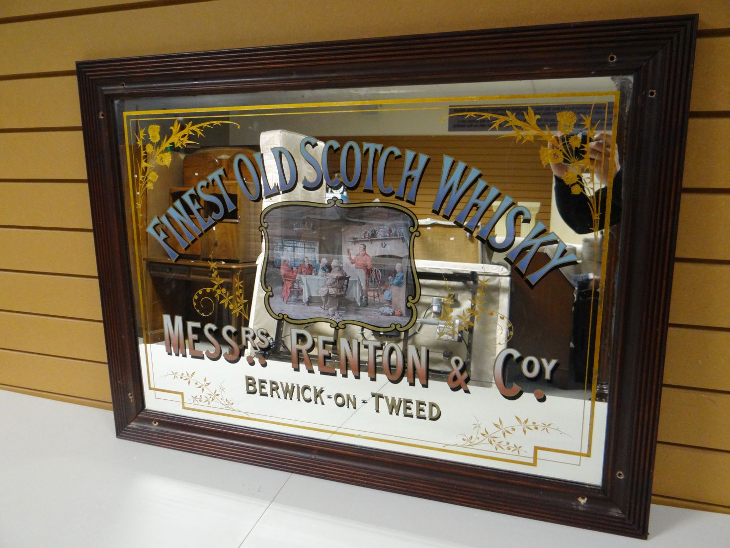 A public house advertising mirror for 'Messrs Renton & Co' in a reeded frame, 39 ins x 29 ins (100 x