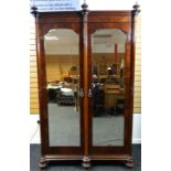 A late nineteenth century mahogany wardrobe by Maple & Co, with two mirrored doors, 89 ins high (226