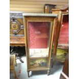 A reproduction vitrine cabinet with single glazed door and painted panel of two courting figures,