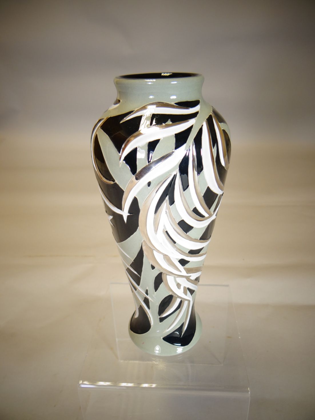 A Moorcroft pottery baluster vase in the 'New Zealand Fern' pattern, 8 ins high (20 cms)