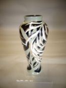 A Moorcroft pottery baluster vase in the 'New Zealand Fern' pattern, 8 ins high (20 cms)