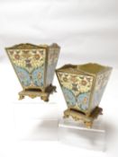 A pair of ormolu and cloisonne four-sided planters raised on decorative four footed bases, 5.5 ins