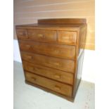 A dark oak Brynmawr Furniture 'Govilon' chest of four long and three short panelled drawers, 35.5