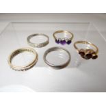 Five mixed rings - three marked as 9ct, a believed to be white gold band ring (mark unclear) and