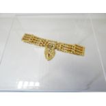 A 9ct yellow gold gate bracelet with heart-shaped pad-lock, 15.08gms
