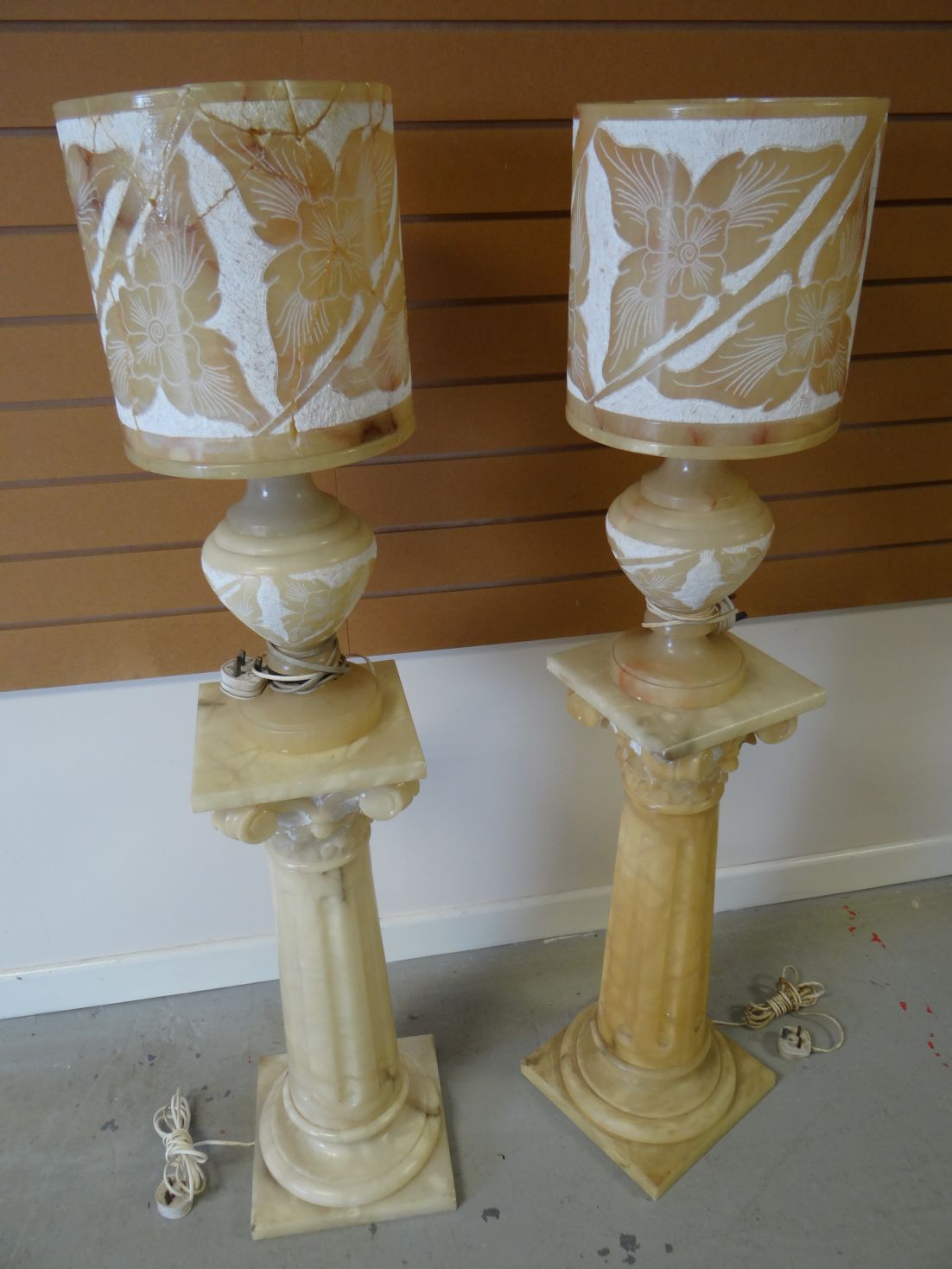 A pair of twentieth century marble floor-standing lamps on square bases with fluted and tapering