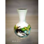 A Moorcroft pottery onion shaped vase in the 'Pied Wagtail' pattern, 7 ins high (18 cms)