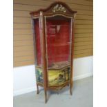 A reproduction vitrine cabinet with single glazed door with landscape printed panel and yellow metal