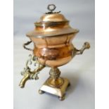 A copper and brass handled twin-handled samovar (damage to lid)