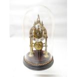 A fine quality brass skeleton clock on a circular ebonised base with glass dome and having