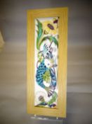 A Moorcroft framed pottery plaque in the 'Fishing for Dreams' pattern, 6 x 16 ins (15 x 41 cms)