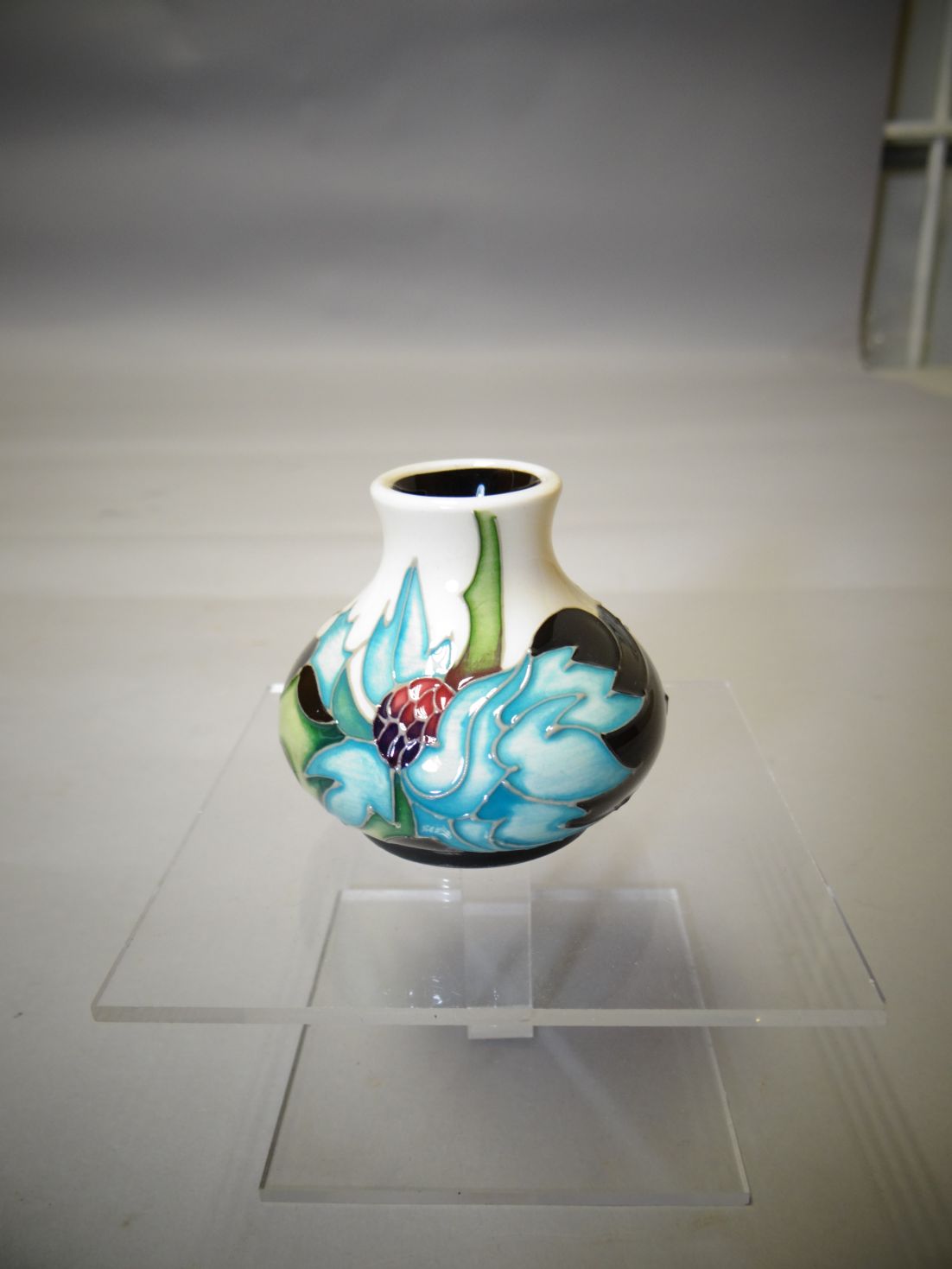 A small Moorcroft 'Sea Holly' ovoid vase, 2.25 ins high (6 cms)