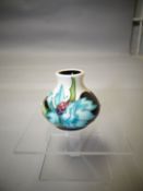 A small Moorcroft 'Sea Holly' ovoid vase, 2.25 ins high (6 cms)