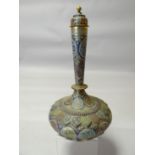 An enamelled yellow metal Persian covered vase, onion shaped and profusely typically decorated in