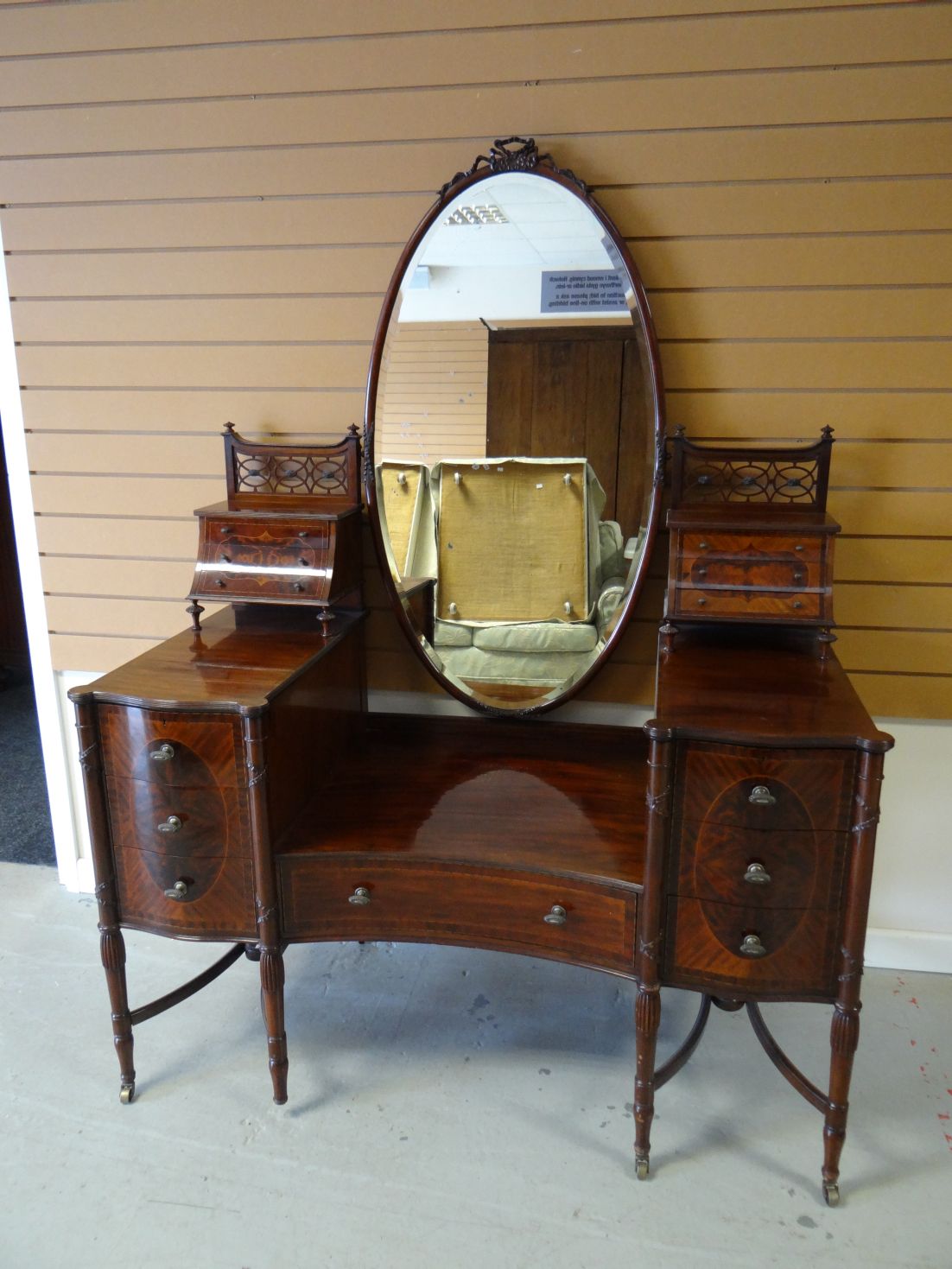 A late nineteenth century mahogany dressing-table by Maple & Co, (to match Lots, 23, 24, 25 & 27)