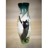 A Moorcroft pottery slender vase in the 'High Jump Cats' pattern, 10 ins high (26 cms)