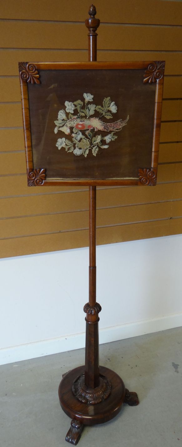 Late-Victorian circular-based rosewood pole-screen on three carved feather feet, and with further