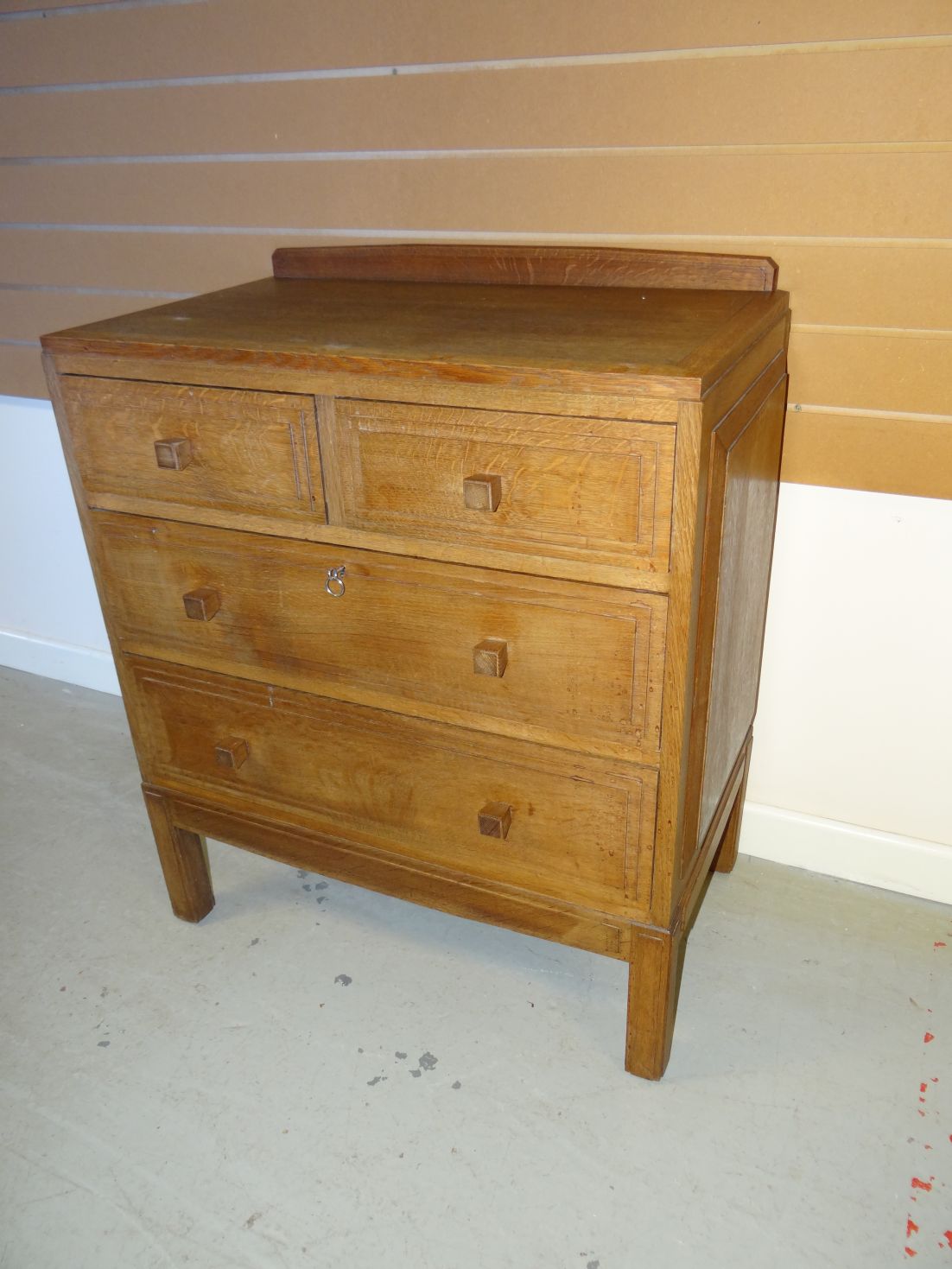 A small light oak Brynmawr Furniture chest of two long and two short drawers bearing Brynmawr label,