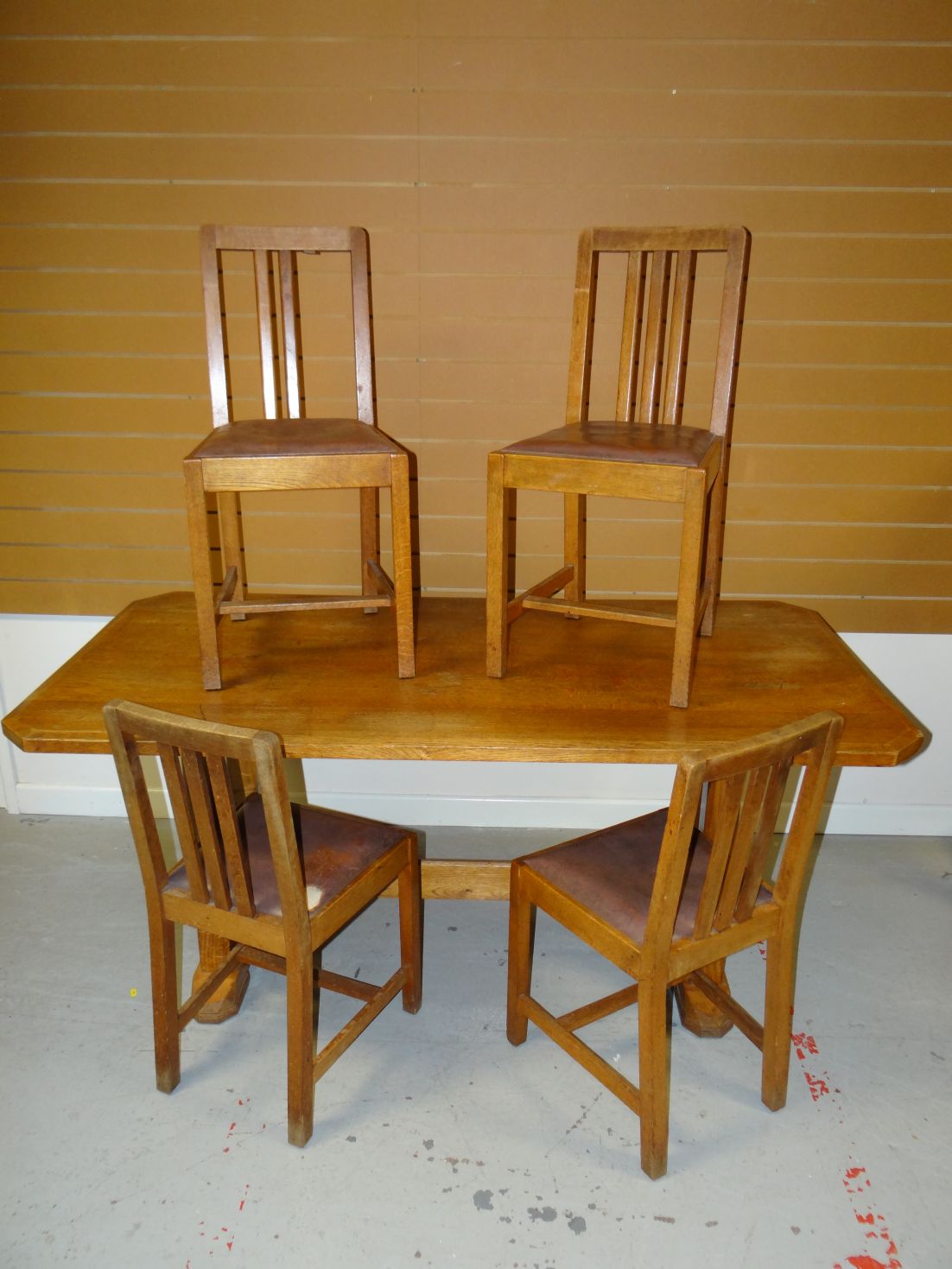 A light oak Brynmawr Furniture 'Tretower' dining table on stile feet with stretcher and bearing