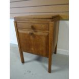 A light oak Brynmawr Furniture night cabinet / sewing table with swivel-fold top above a single