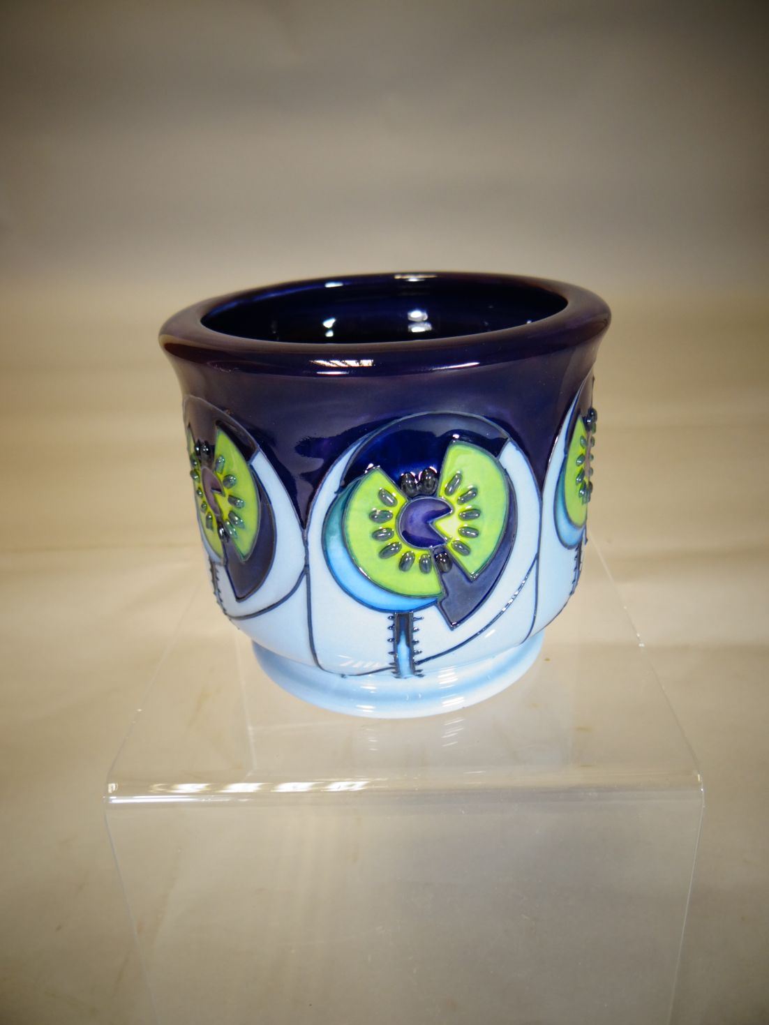 A small Moorcroft pottery planter in the 'Cinco Blue' pattern, 3.5 ins high (9 cms)