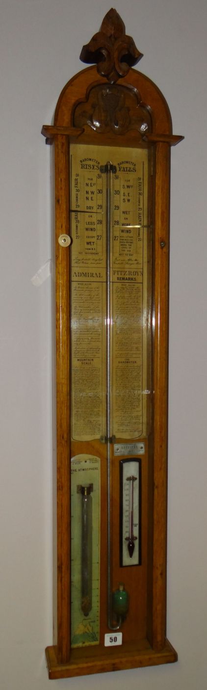 An early-Victorian light oak carved encased Admiral Fitzroy barometer, complete with mercury