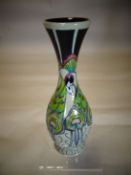 A Moorcroft pottery waisted vase in the 'Peacock Parade' pattern, 10 ins high (26 cms)