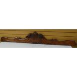 A mahogany furniture cornice carved with the Prince of Wales Feathers and 'ICH DIEN', 77 ins long (
