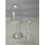 Two clear double covered re-agent bottles