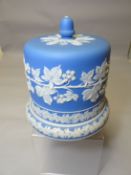 A Staffordshire blue and white jasperware stilton dish with stand base decorated with applied