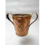 A rare copper arts and crafts copper twin handled planter with embossed floral metal work produced