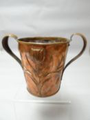 A rare copper arts and crafts copper twin handled planter with embossed floral metal work produced