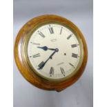 A Smiths of Enfield circular dial classroom wall-clock having Roman Numerals to the white enamel