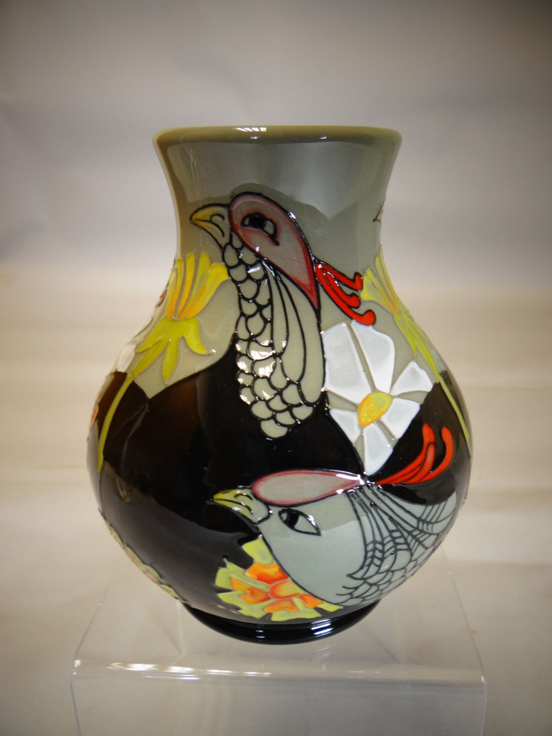 A Moorcroft pottery ovoid vase in the 'Courting Birds' pattern, 6 ins high (15 cms)