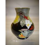 A Moorcroft pottery ovoid vase in the 'Courting Birds' pattern, 6 ins high (15 cms)