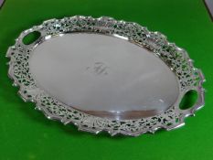 A heavy quality Walker & Hall EPNS oval tray having twin hollow handles and floral pierce-work