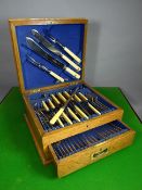 A Thomas Turner & Co 'Hygenic Steel' forty-two piece cutlery set in a light coloured oak canteen