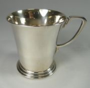 A plain silver, slightly-waisted mug, monogrammed, Sheffield 1956, 4 ozt, Mappin & Webb