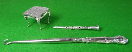 An Italian miniature silver clarinet, marked 925; together with a silver handled button-hook and a