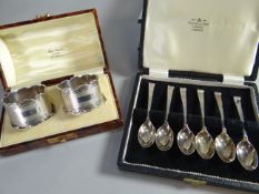 A cased pair of machine-turned, silver napkin rings with shaped rims, Birmingham 1933, 2.7 ozt,