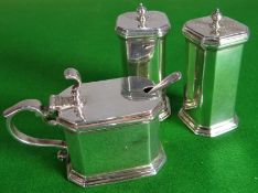 A three-piece silver condiment set of angular form by Samuel Walton Smith & Co, Birmingham 1919,