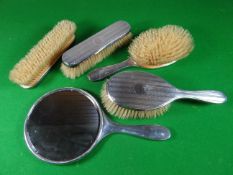 A set of four machine-turned, silver-backed brushes and matching hand-mirror, London 1926
