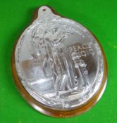 An oval silver plaque for 'PEACE 1919' by Edward Carter Preston (designer of the WW1 memorial