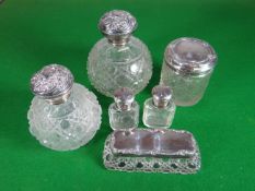 A parcel of six mixed silver topped glass dressing containers
